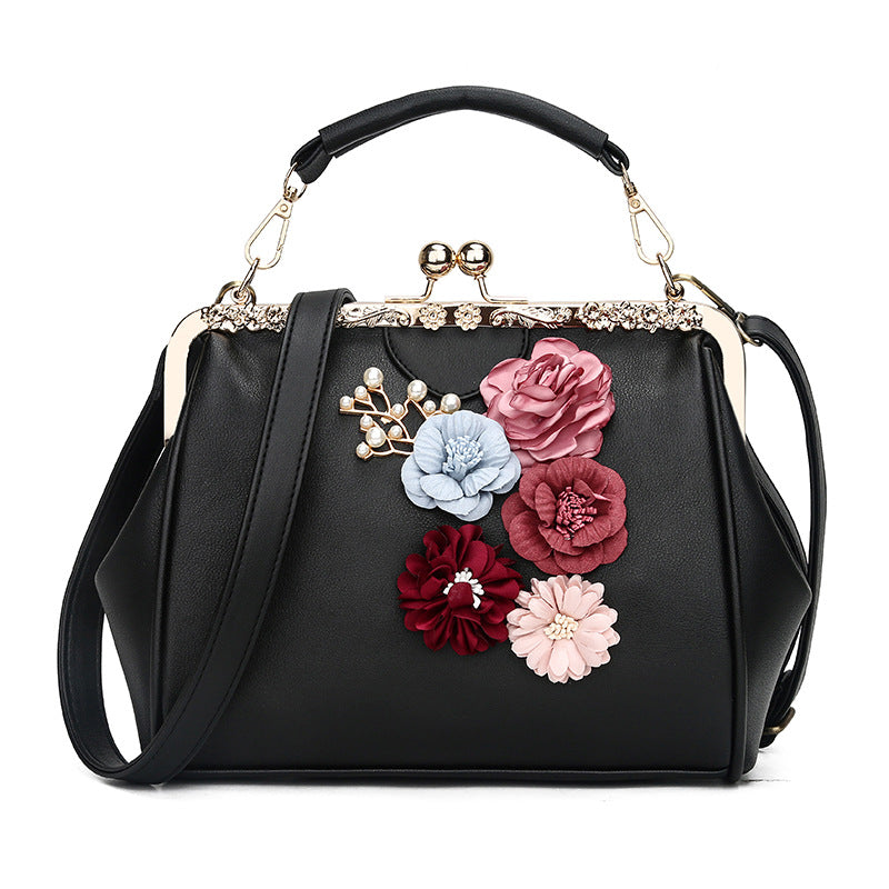 Embossed flower metal clip handbag