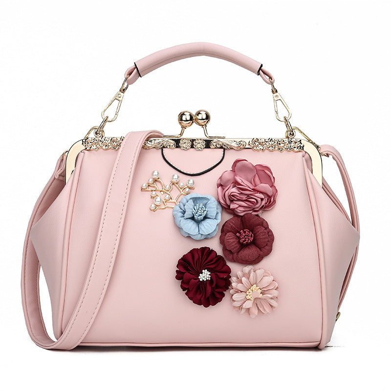 Embossed flower metal clip handbag